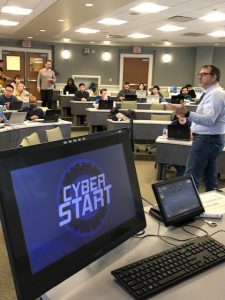 Chris Croad addresses the students gathered for the CyberStart kickoff party