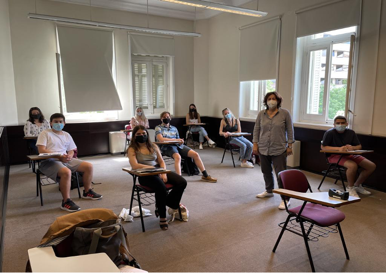 A group of students at the Madrid Center, attending an in-person class.