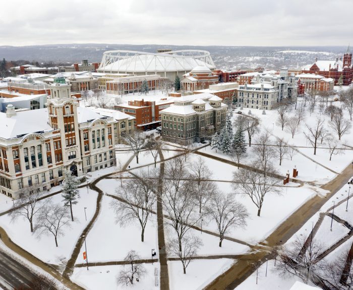 Aerial view of Syracuse University campus coved with fresh snow